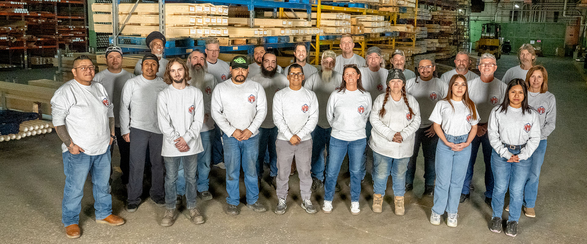 National Metal Shapes team photo in their warehouse